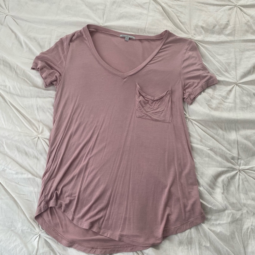Light pink T-shirt.